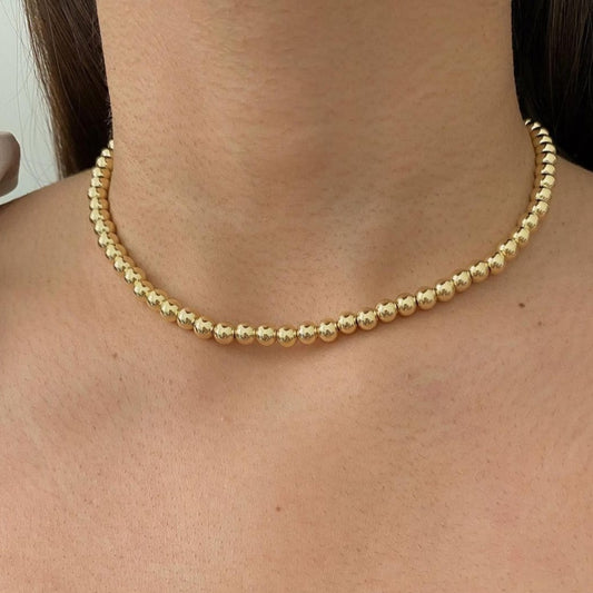 Gold ball choker